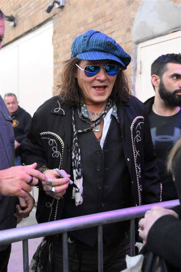 Johnny Depp Smiles Behind Bars For Film Festival In First Public Pic Since Losing Libel Suit & ‘Harry Potter’ Role