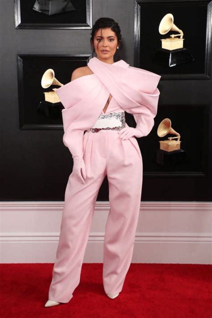 Kylie Jenner Wears Pink Latex Leggings & Bra As She Announces Makeup Company Is Going ‘Vegan’