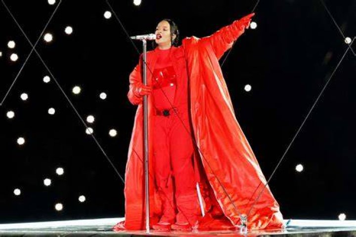 Pregnant Rihanna Shows Off Bump In Neon Aquamarine Cutout Catsuit Paris Fashion Week — Photos