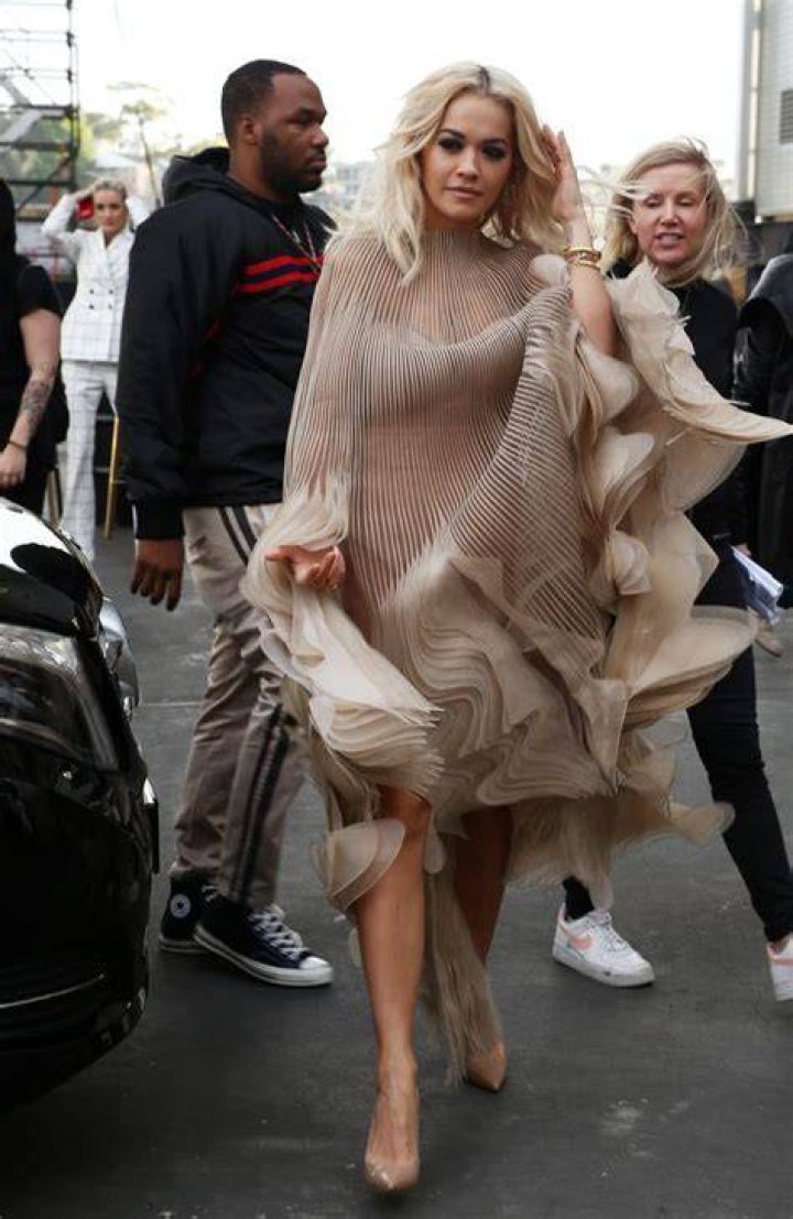 Rita Ora Suffers Wardrobe Malfunction When Yellow Dress Blows Up In Miami Breeze
